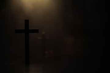 Silhouette of a Cross in Dim Light Symbolizing Faith and Solitude
