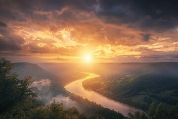 Dramatic panoramic landscape of the mountains, river, cloudy sky with sun flare in the sky