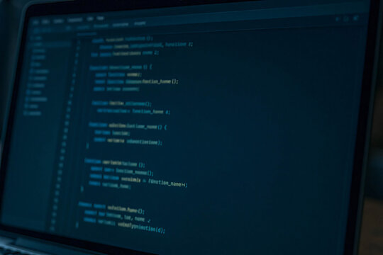 Blurry Computer Screen Displaying Programming Code
