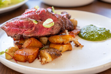 Grilled Beef Steak with Potatoes and Herb Sauce