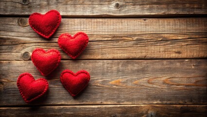 Fototapeta premium Warm Red Hearts on Rustic Wooden Table, couple not present, inviting, couple not present, inviting, cozy