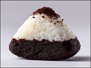 Close up image of Japanese Onigiri, a rice ball covered in powder