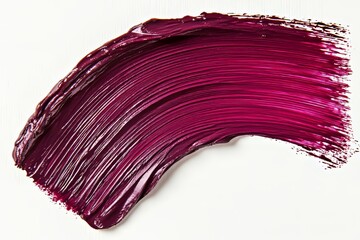 Isolated on a white background, a dark red paint brushstroke with scattered droplets creates an abstract artistic texture, as seen in this macro shot designed for use in design and print