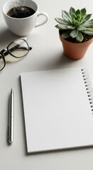 Blank notepad, pen, coffee cup, eyeglasses, succulent plant on white table, showcasing a minimalist workspace, ideal for mockup or branding