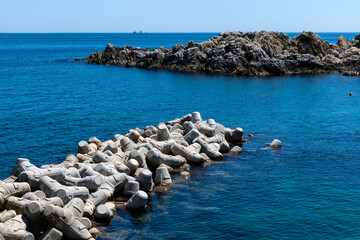 seascape with tetrapods on a sunny day