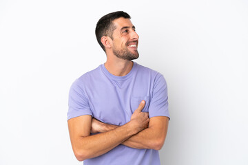 Fototapeta premium Young handsome caucasian man isolated on white background happy and smiling