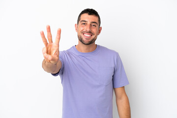 Fototapeta premium Young handsome caucasian man isolated on white background happy and counting three with fingers