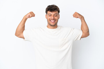 Young caucasian handsome man isolated on white background doing strong gesture