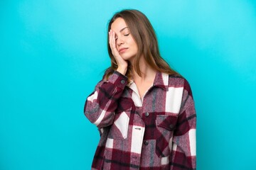 Fototapeta premium Young caucasian woman isolated on blue background with headache