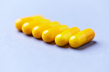 Vitamin C capsules. Bright background. Close up. Copy space.	