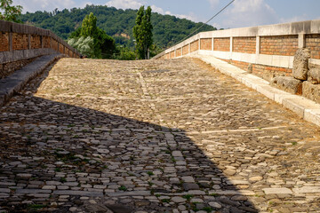 Ponte Leproso, an ancient Roman bridge with cobblestones in Benevento, Italy