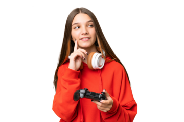 Teenager caucasian girl playing with a video game controller over isolated background thinking an idea while looking up
