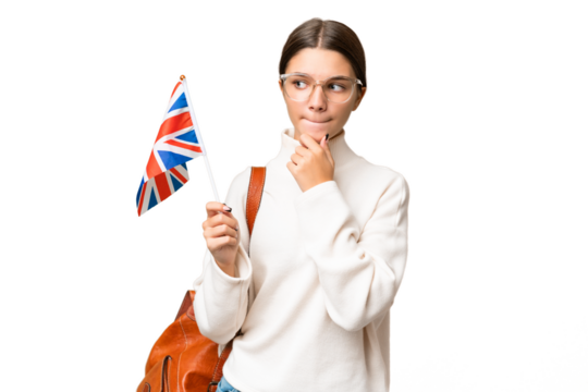 Teenager student caucasian girl holding an United Kingdom flag over isolated background having doubts and thinking
