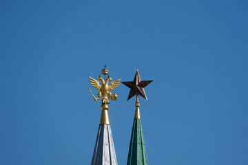 A golden eagle on a silver spire and a Soviet ruby star on a green Kremlin spire contrast Russia's...