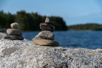A Tranquil Waterscape Rock Balancing and Serene Ocean View
