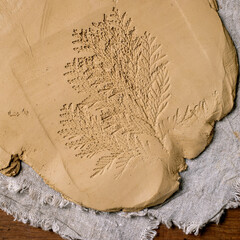 Decorating of raw clay ceramics