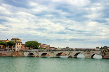 Old stone Tiberius bridge in Rimini, Italy