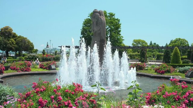 
Yokohama, Japan - 05 June 2025 : Guardian of Water statue, fountain and flower gardens at Yamashita Park, first seaside park in Japan in front of Yokohama Port, between Osanbashi and Yamashita Pier