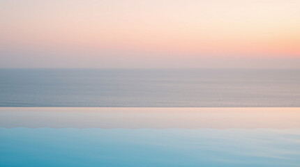 Fototapeta premium Infinity pool with calm water reflecting the serene sky at sunset.
