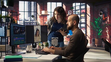 Professional editor uses AI powered software and PC reels in a creative office, marketing strategy used in targeting viral trends and boosting online followers and exposure. Camera A.