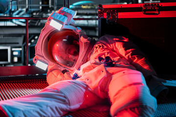 Red light alert blinking over unconscious astronaut losing life in accident onboard space station...
