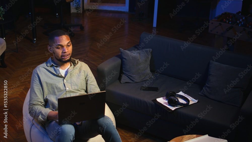 Poster black man joining online lesson to work on new skills from home space, attend web conference call an