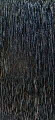 Dark vertical wood grain texture suitable for backgrounds, design projects, furniture, flooring, decor, rustic themes, and natural textures.