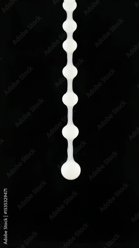 Poster monochromatic ink droplets dissolving gently, creating abstract patterns through fluid dynamics, rev