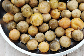 Though seemingly not fresh, these limes are drying for candied sweets, later steeped in syrup for a...