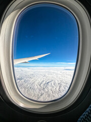 Fototapeta premium Airplane Wing View Over Clouds