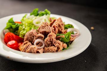 Tuna salad green leaf lettuce, canned tuna, tomato fresh delicious gourmet food background on the table rustic food top view copy space keto and paleo diet vegetarian food pescetarian diet