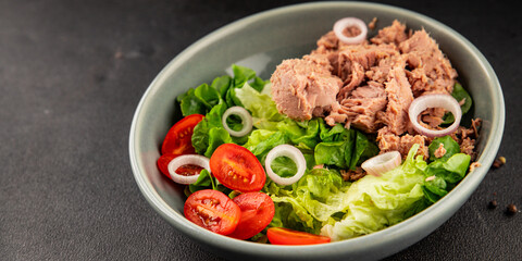 Tuna salad green leaf lettuce, canned tuna, tomato fresh delicious gourmet food background on the table rustic food top view copy space keto and paleo diet vegetarian food pescetarian diet
