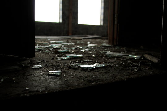 Broken glass on the floor in abandoned building