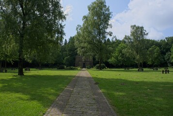 Kleve, Germany - Jun 2, 2025: The German War Cemetery Kleve-Donsbrugger Heide contains 874 german war graves from WW2. Sunny spring day. Selective focus