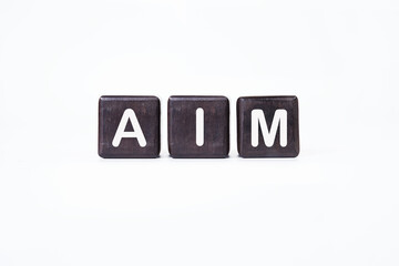The AIM concept word is assembled from cubes. Business concept