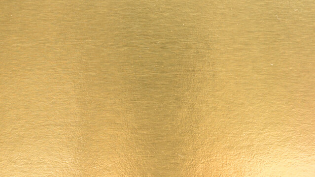 Gradation gold foil leaf shiny matt with sparkle yellow metallic texture background.
Abstract paper glitter golden glossy for template.
top view.