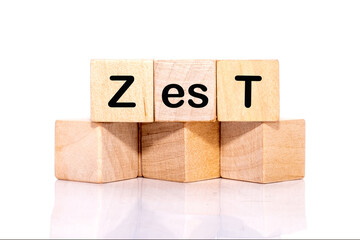 The concept word ZEST is assembled from wooden cubes. emphasizing motivation and creativity concept