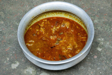 Delicious homemade slow cooked beef curry in silver pot. Cooked on village mud stove in Bangladesh. Protein rich, healthy meal.