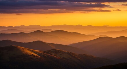 Golden Mountain Range Layers at Sunset with Orange Hues and Cloudy Sky