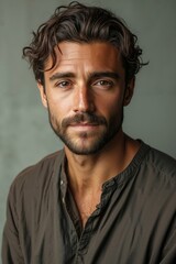 Fototapeta premium A man with a beard and a brown shirt