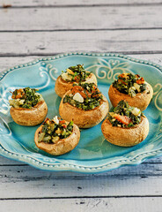 plate of stuffed mushrooms with spinach and goat cheese