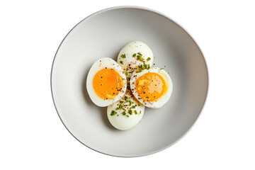 Egg-cellent breakfast: An appetizing top-down shot of halved, boiled eggs in a sophisticated bowl, revealing the perfect golden yolks, capturing a satisfying and delicious breakfast experience.