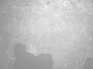 Rough textured concrete surface with visible scratches and scuffs, creating an industrial and raw...