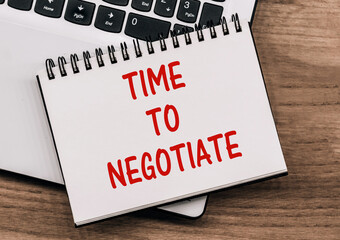 Time To Negotiate Written On A Notepad On A Desk