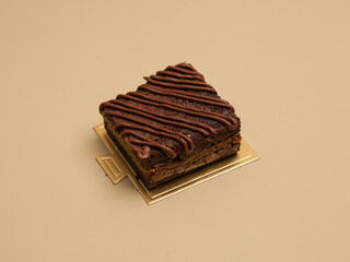 Freshly baked pastry with topping, on beige background