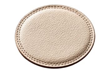 Round, light beige leather coaster with stitched edge