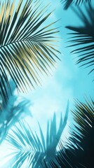 Tropical Serenity: Lush Green Palm Fronds Silhouetted Against a Bright Blue Sky, Evoking a Tranquil Island Vibe with Soft Light and Natural Beauty