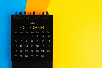 Black mini calendar for October 2025.