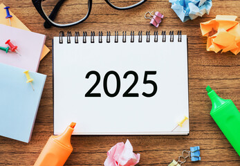 Planning for Business Growth and Success in the New Year 2025 With Tools and Supplies on a Wooden Desk