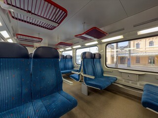 Ultra wide angle shot of interior of modern czech train with seats